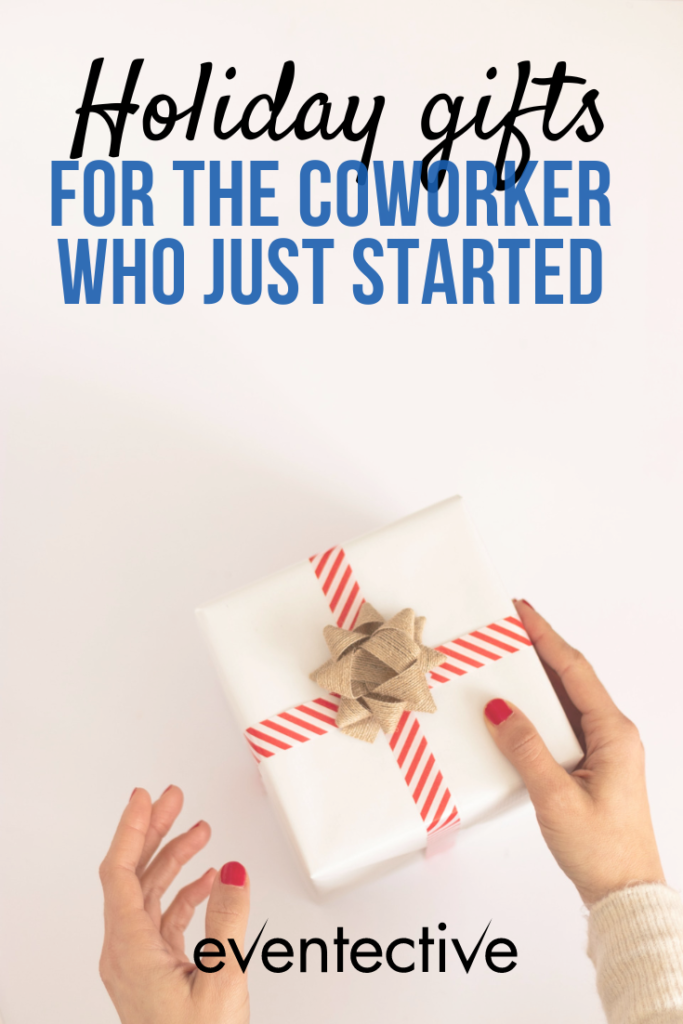 image of woman holding white, wrapped present with overlay text that says "holiday gifts for the coworker who just started"