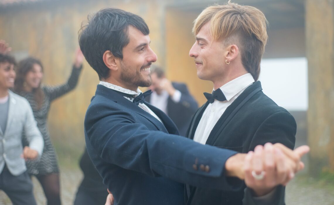 Two grooms dancing at their wedding