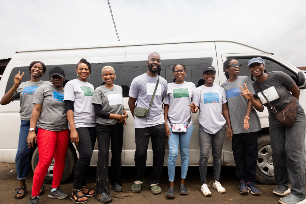 Volunteers standing in front of a van