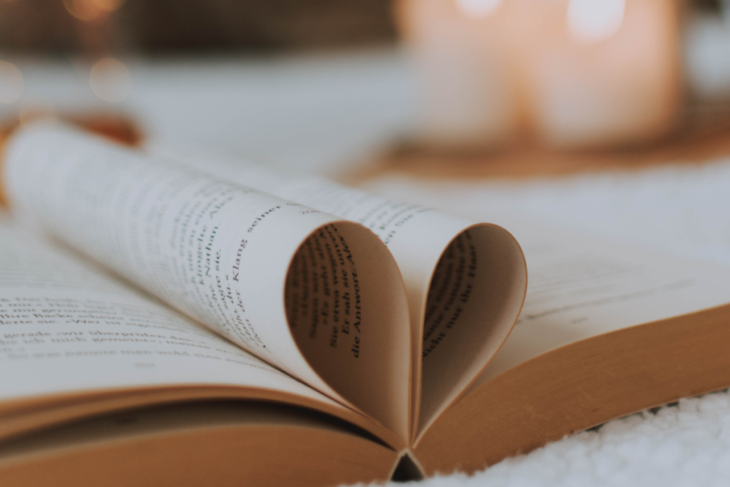 A book open with pages set in the shape of a heart