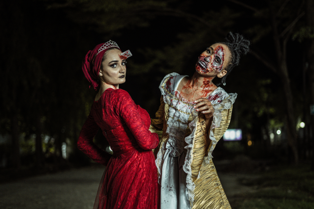 Women dressed in Halloween costumes on a dark street
