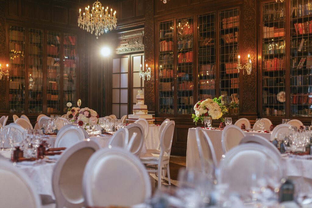 Library venue set up with tables and chairs for a wedding