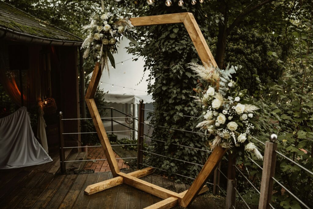 Mirror set up at a wedding decorated with flowers