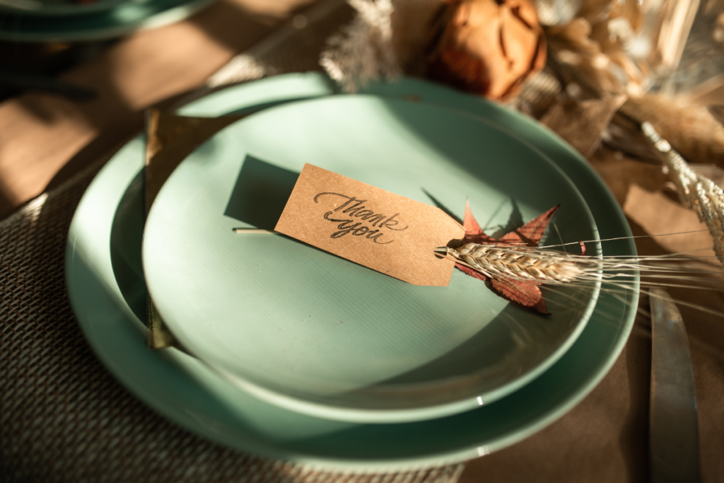 Place setting on a wooden table with a "Thank You" label