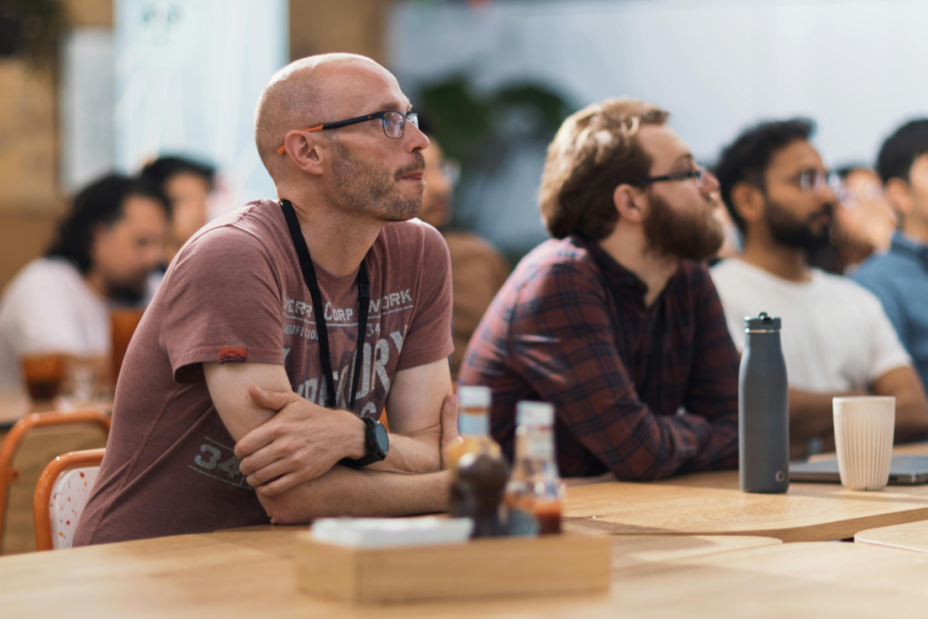 Group of men sitting at a conference