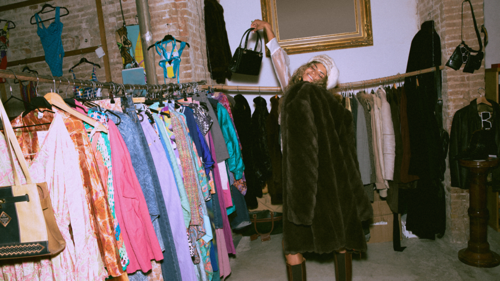 Woman at a thrift store in a fur coat