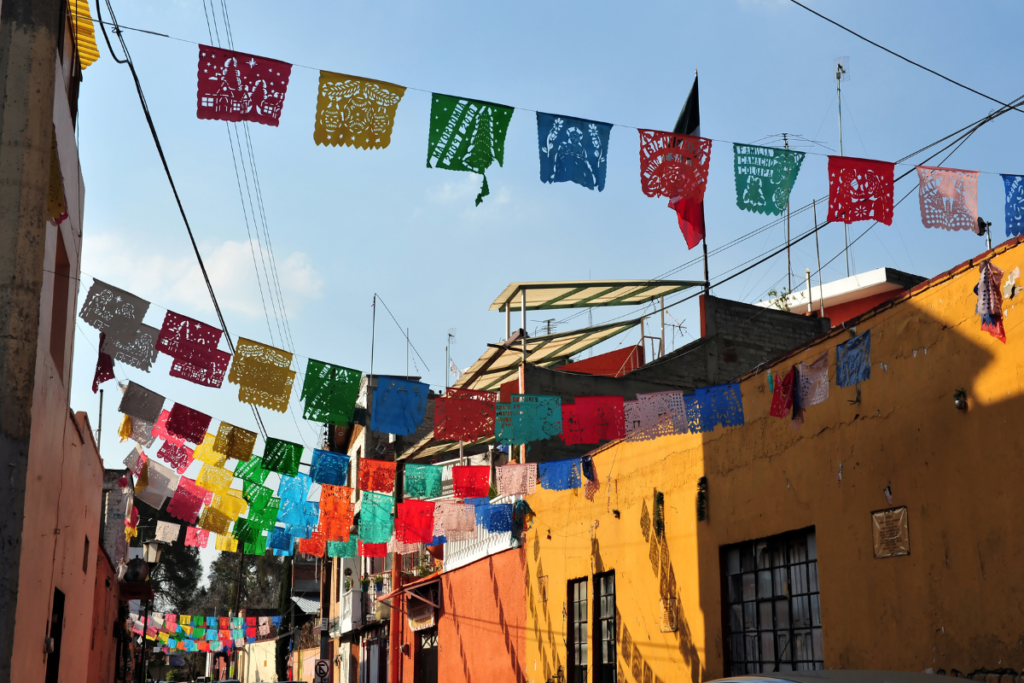 Colorful flags strung up on a street in Mexico City, Mexico