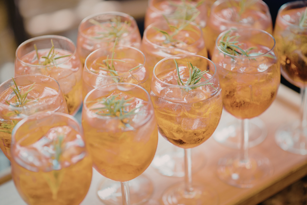 Spritzes in wine glasses on a tray